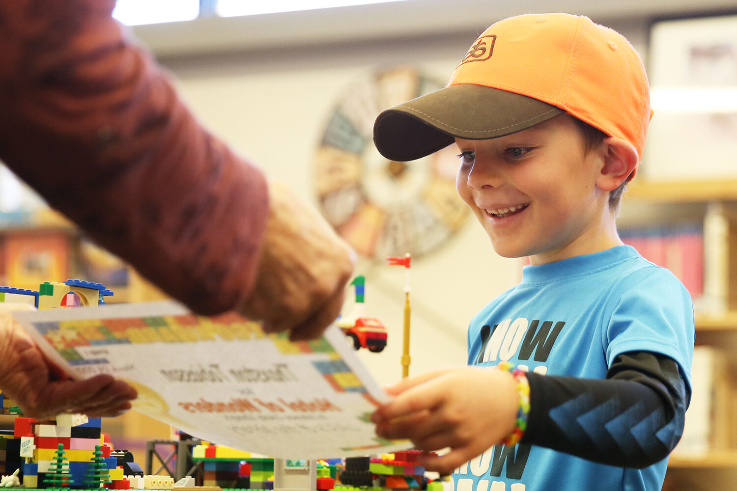 Thaxston Tobiasson, 6, grins in excitement